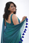 Navilu – Peacock Colour Linen Tissue Self Saree withTassels