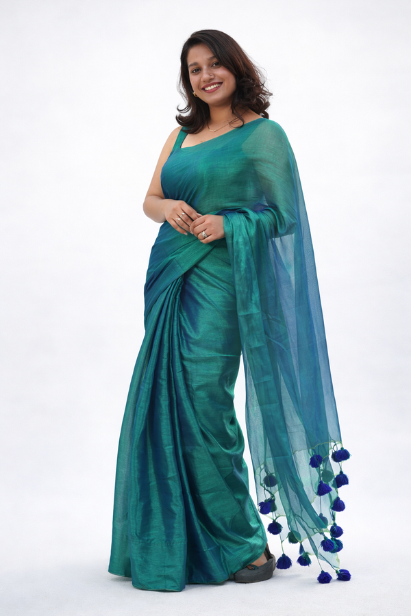 Navilu – Peacock Colour Linen Tissue Self Saree withTassels